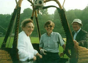 Picture of balloon basket with pilot, mother and family friend